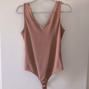 Mauve/ pinkish Onesie